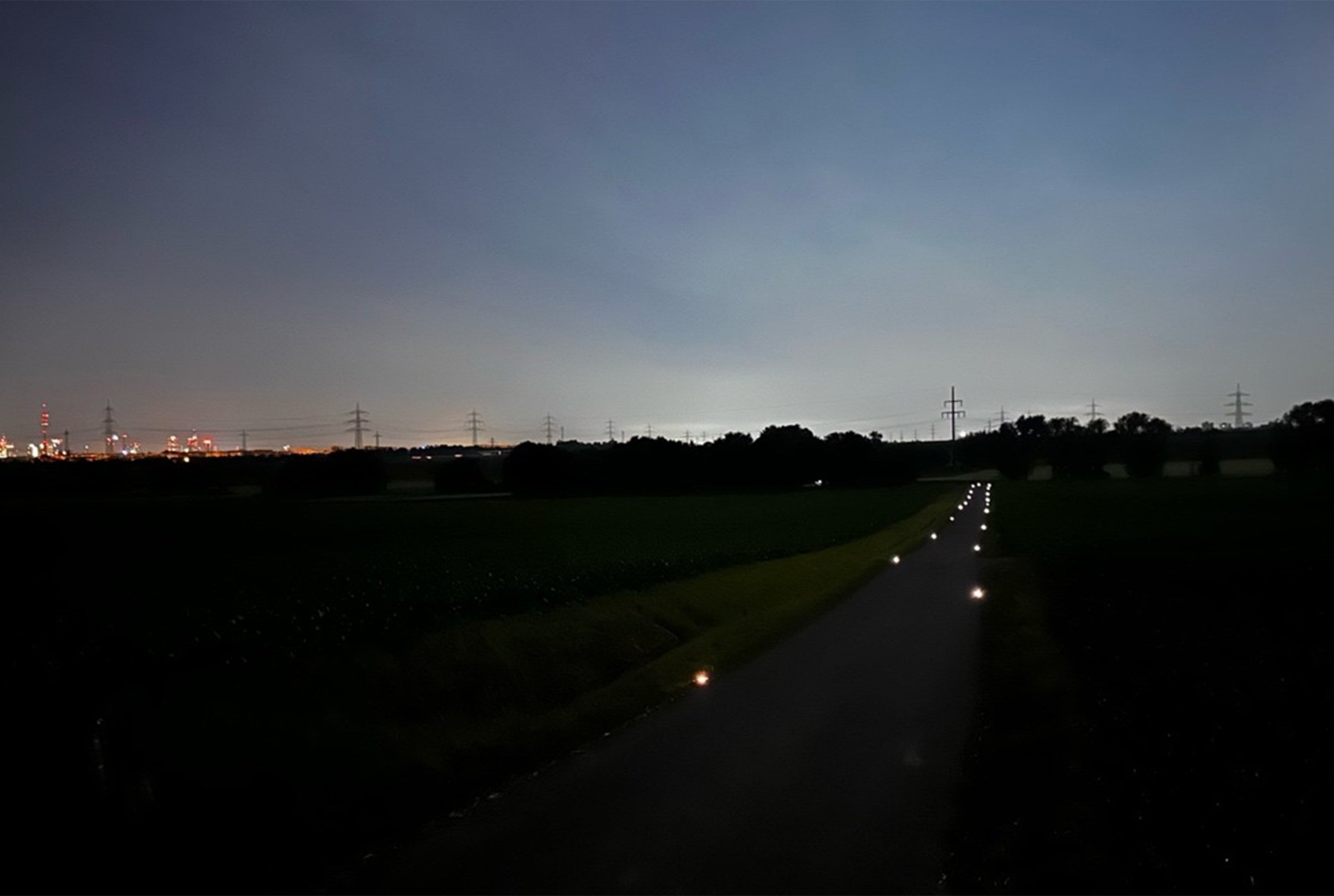 Cycle path at dusk, Road Studs lining the route in the direction of travel