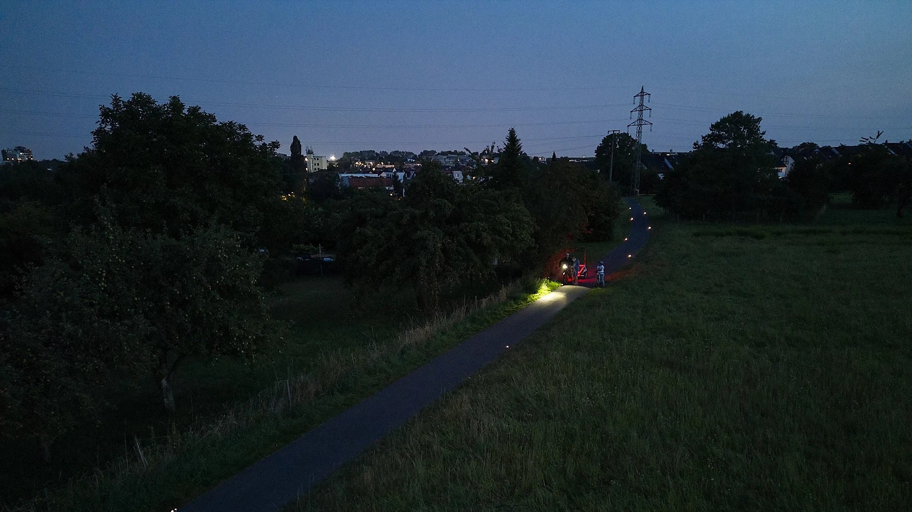 Aerial view of a cycle path at dusk with Road Studs at the edge of the route