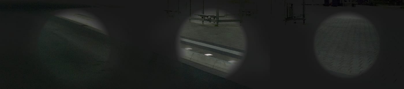 Drei runde Ausschnitte einer dunklen Bodenfläche, im mittleren eine helle Linie aus Lichtpunkten